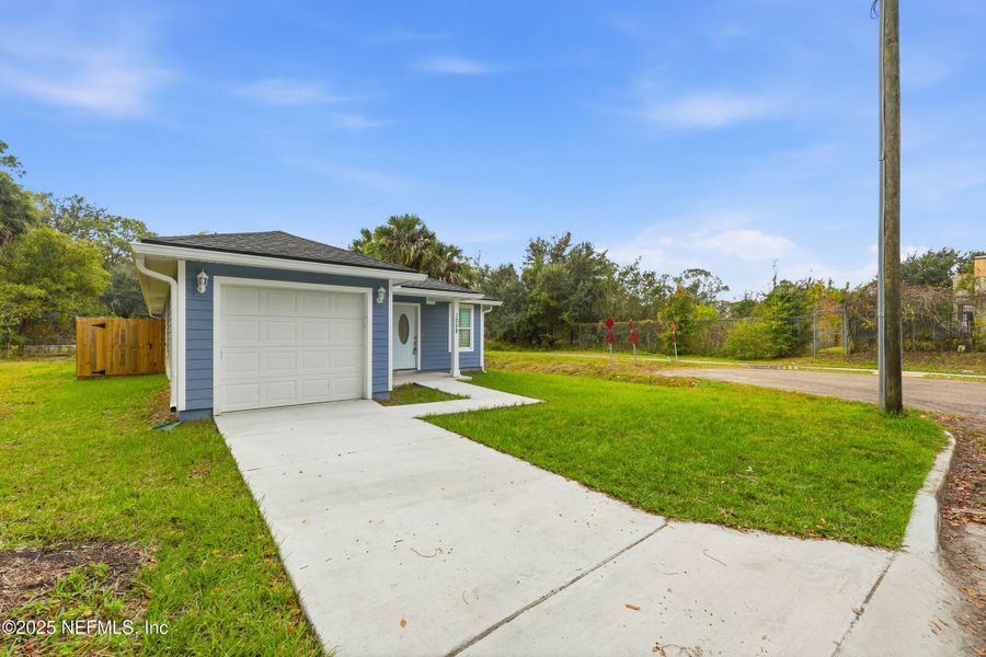 Front exterior of a new home in , Jacksonville, FL, highlighting curb appeal (Image 16).