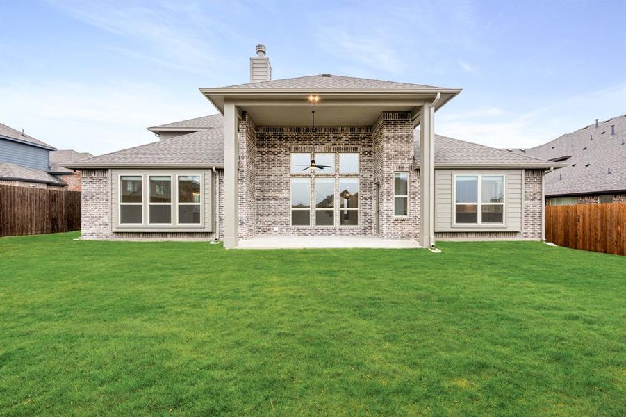 Exterior details and patio area of a home in Villages of Hurricane Creek, Anna (Image 27).