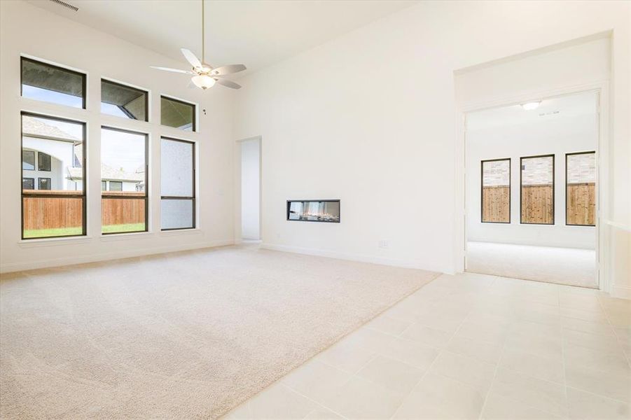 living room area featuring 13 ft ceilings