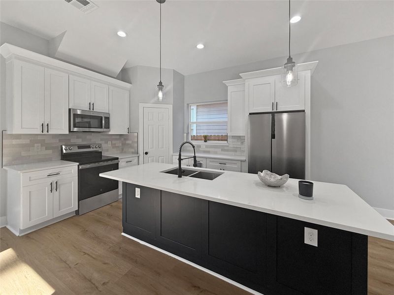 Modern Dream Kitchen featuring an expansive Quartz Island!