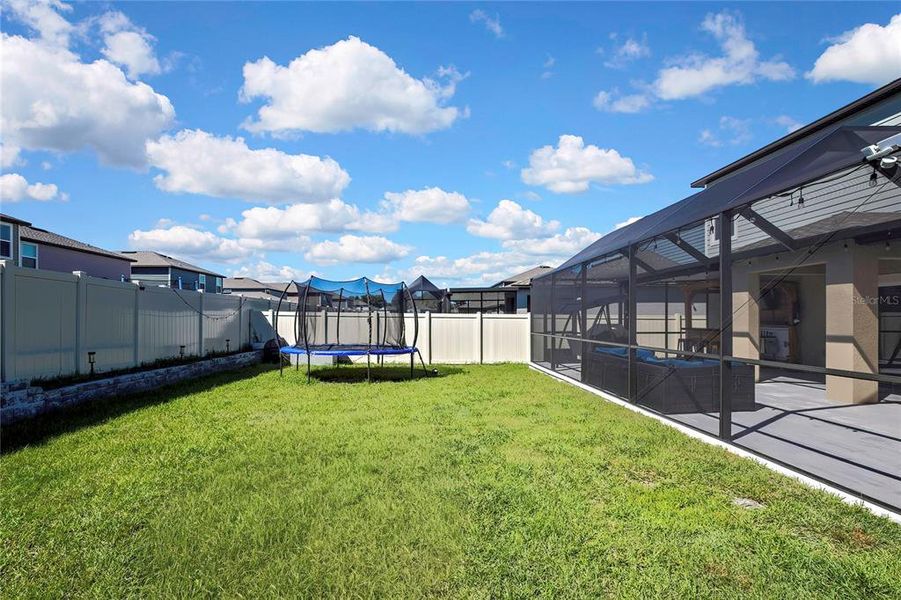 Exterior details and patio area of a home in Angeline: The Estates, Land O' Lakes (Image 28).
