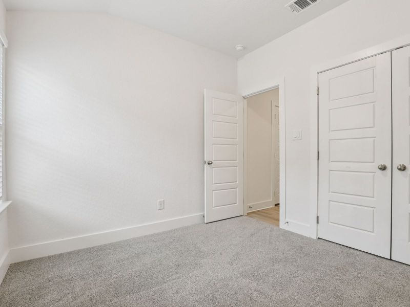 Secondary bedroom in the Callaghan floorplan at a Meritage Homes community.