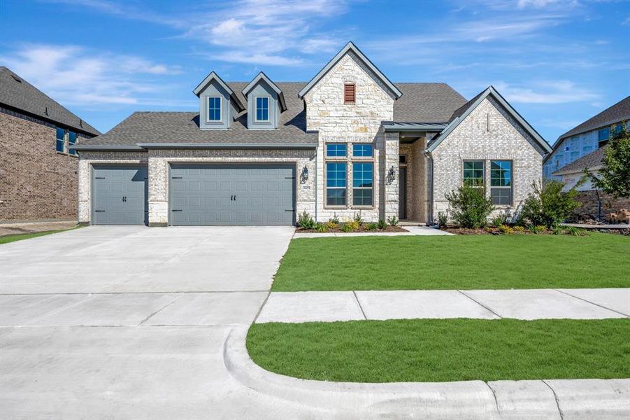 Front exterior of a new home in Kreymer at the Park, Wylie, TX, highlighting curb appeal (Image 1).