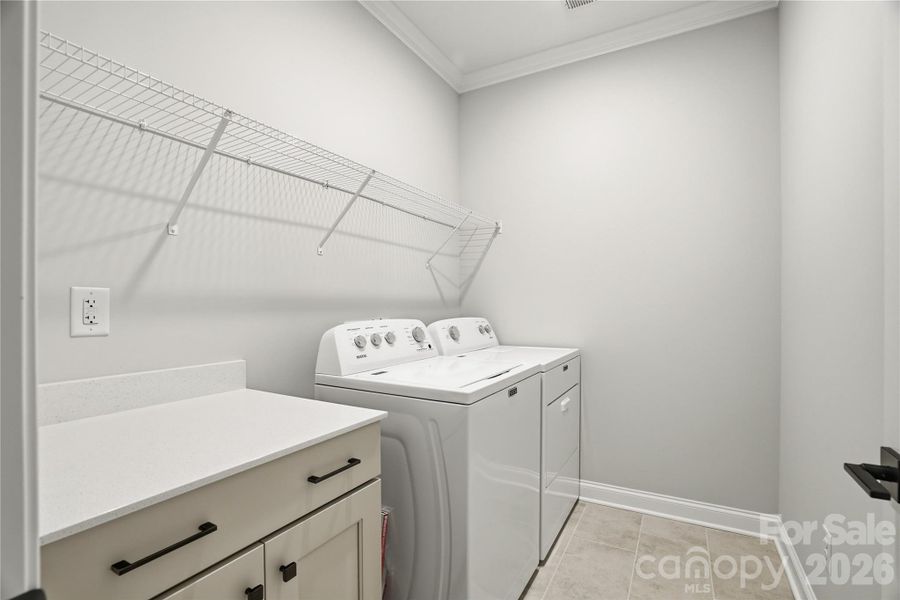 LARGE laundry room with folding station and cabinets LARGE laundry room with folding station and cabinets