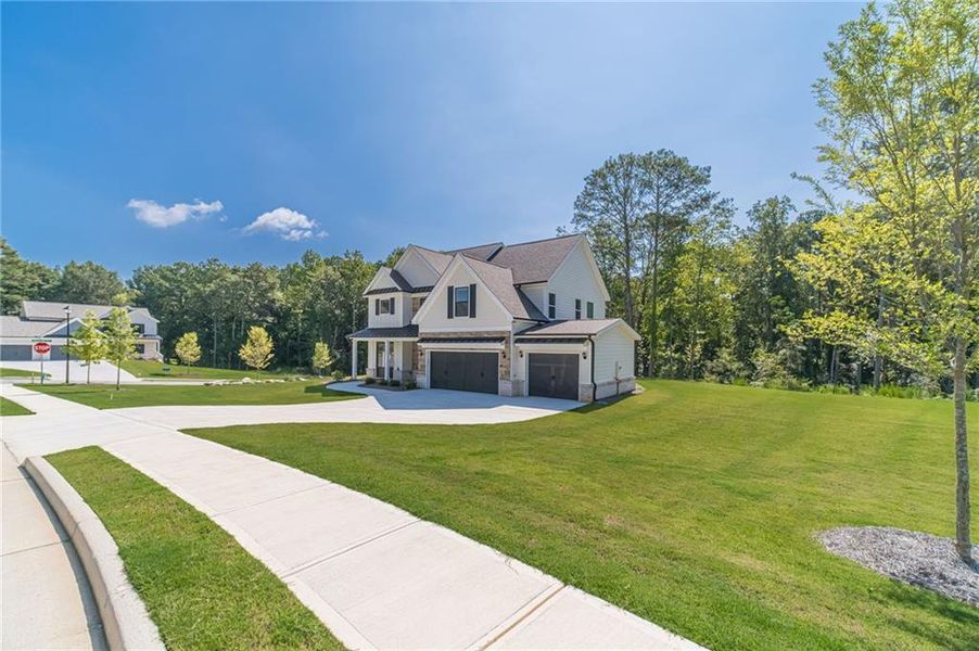 Front exterior of a new home in , Loganville, GA, highlighting curb appeal (Image 28).