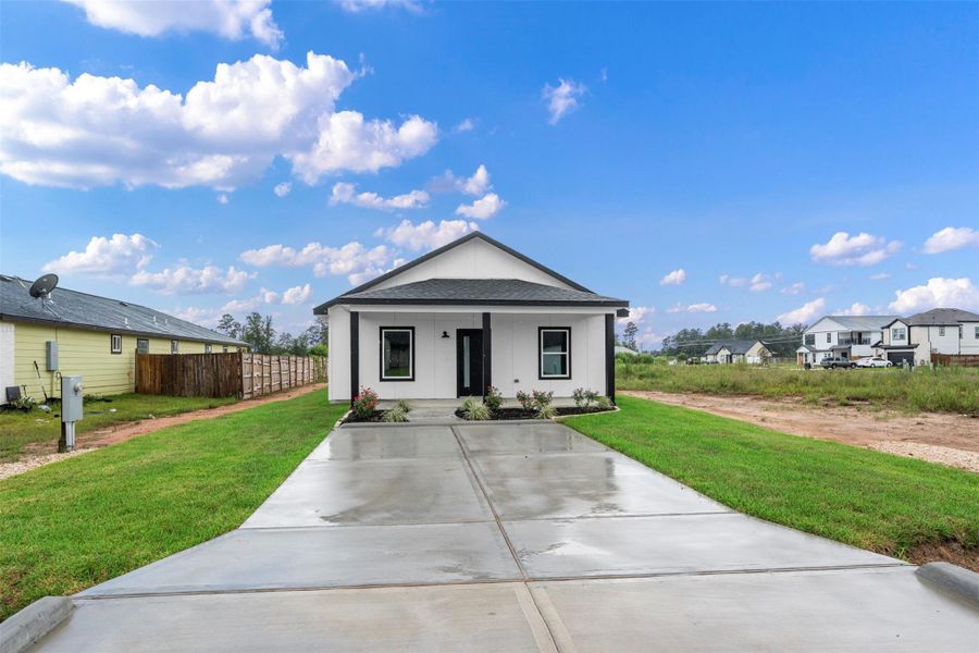 Front exterior of a new home in , Cleveland, TX, highlighting curb appeal (Image 2). Front exterior of a new home in , Cleveland, TX, highlighting curb appeal (Image 2).