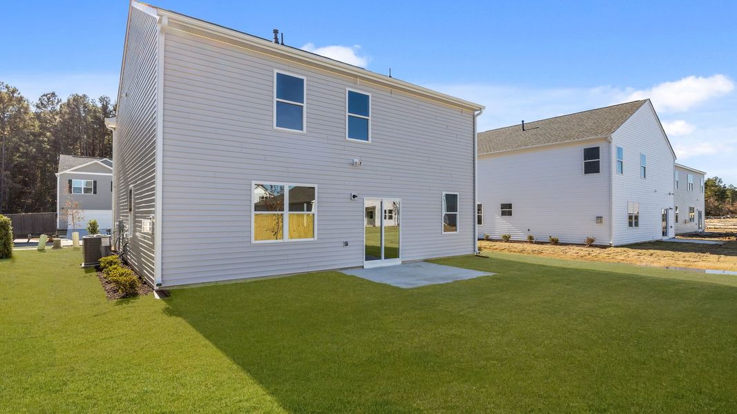 Exterior details and patio area of a home in West New Bern, New Bern (Image 24).