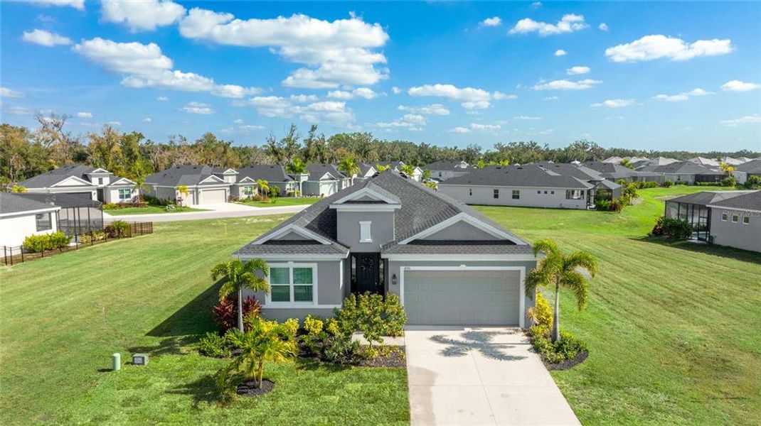 Front exterior of a new home in , Parrish, FL, highlighting curb appeal (Image 1). Front exterior of a new home in , Parrish, FL, highlighting curb appeal (Image 1).