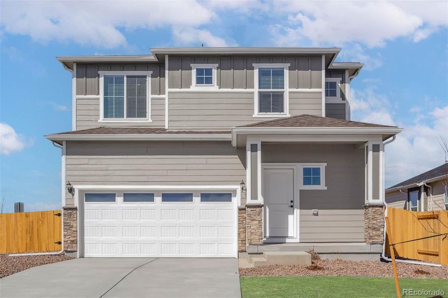 Front exterior of a new home in , Commerce City, CO, highlighting curb appeal (Image 1).