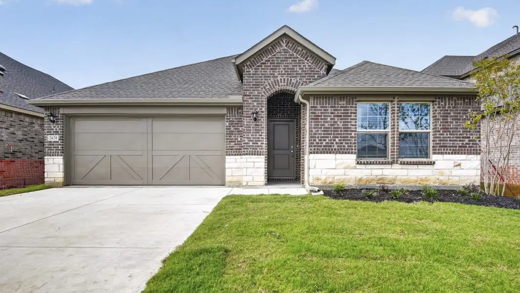 Front exterior of a new home in Lilybrooke at Legacy Hills, Celina, TX, highlighting curb appeal (Image 1). Front exterior of a new home in Lilybrooke at Legacy Hills, Celina, TX, highlighting curb appeal (Image 1).