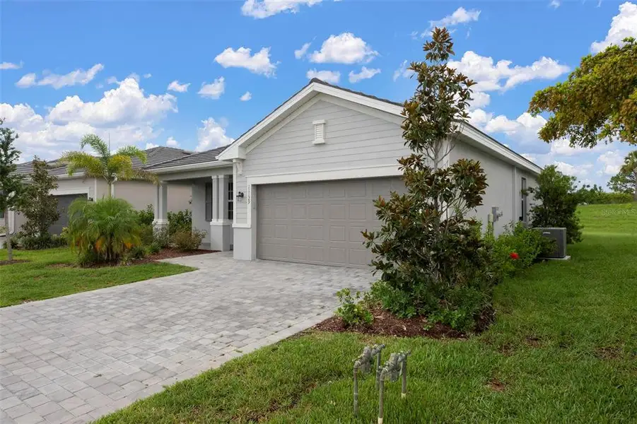 Front exterior of a new home in , Venice, FL, highlighting curb appeal (Image 26).