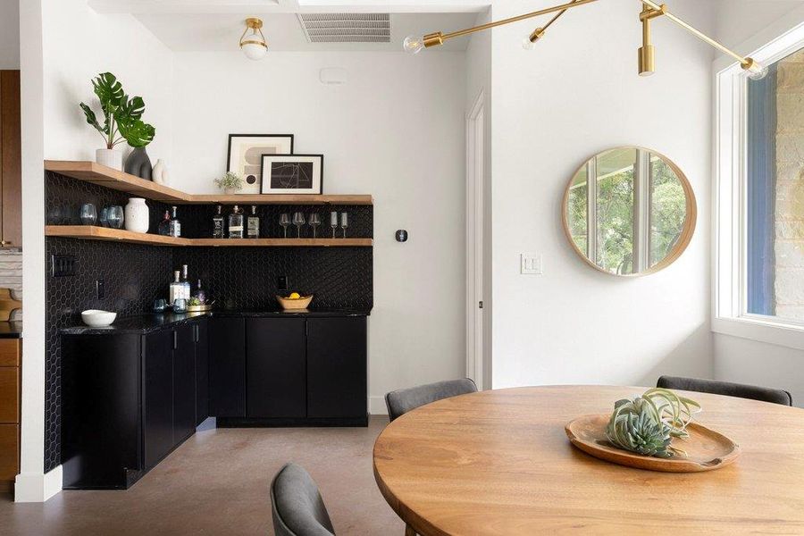 Dining room featuring finished concrete floors