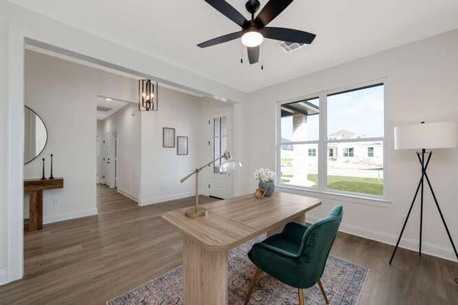 Office with dark wood finished floors and ceiling fan Office with dark wood finished floors and ceiling fan