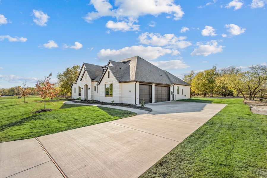 Front exterior of a new home in Rolling Creek Ranch, Aledo, TX, highlighting curb appeal (Image 29).