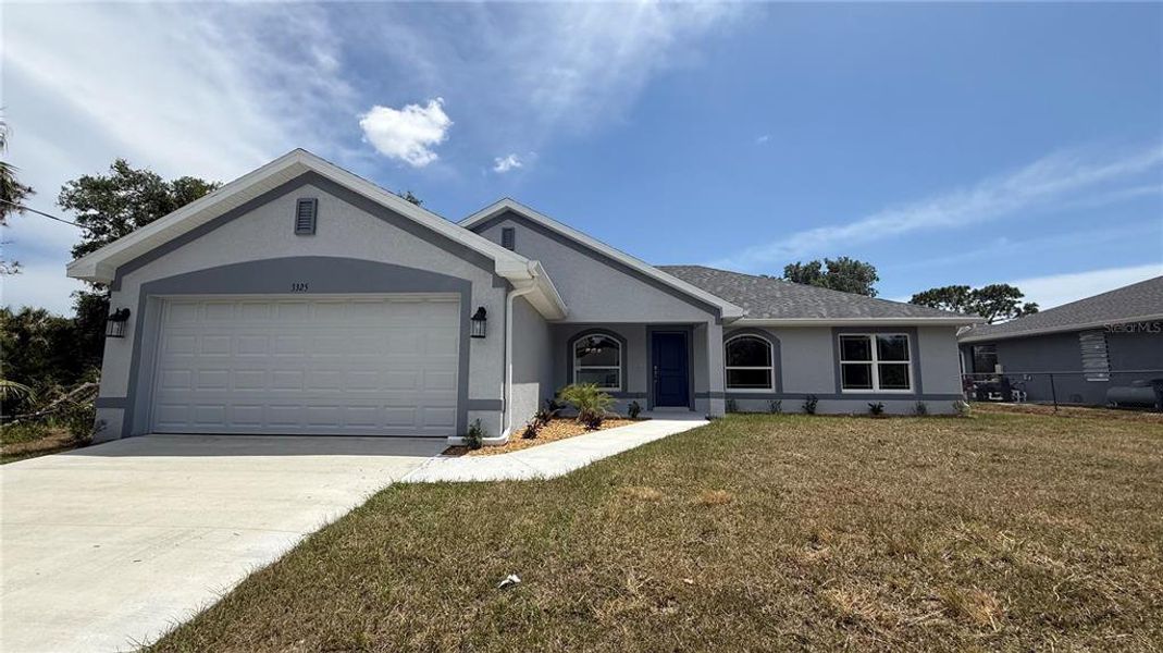 Front exterior of a new home in North Port, North Port, FL, highlighting curb appeal (Image 1). Front exterior of a new home in North Port, North Port, FL, highlighting curb appeal (Image 1).