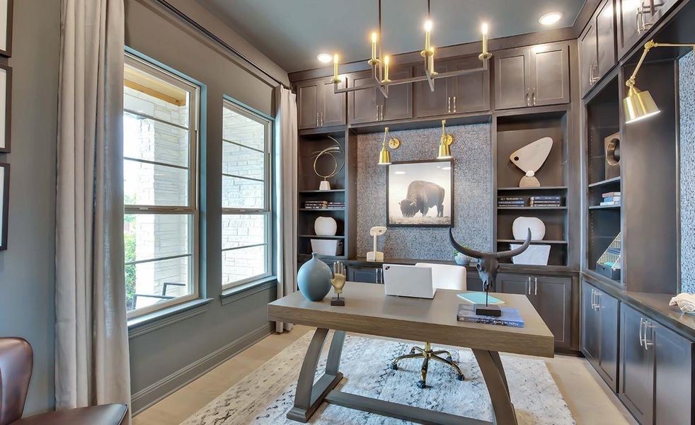 Home office featuring built in shelves