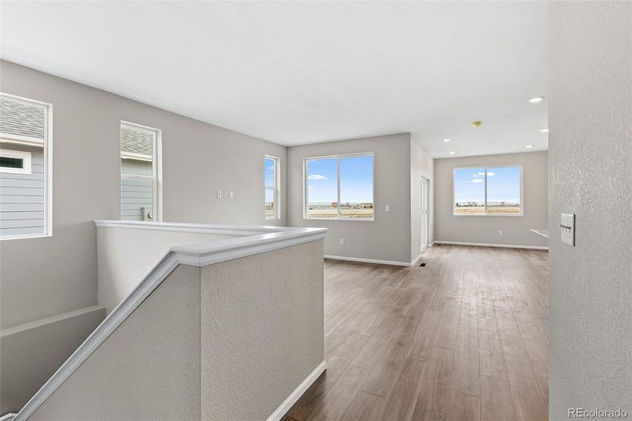 Spacious, unfurnished interior of a new home in The Cottages Collection at Ridgeline Vista, Brighton (Image 13).