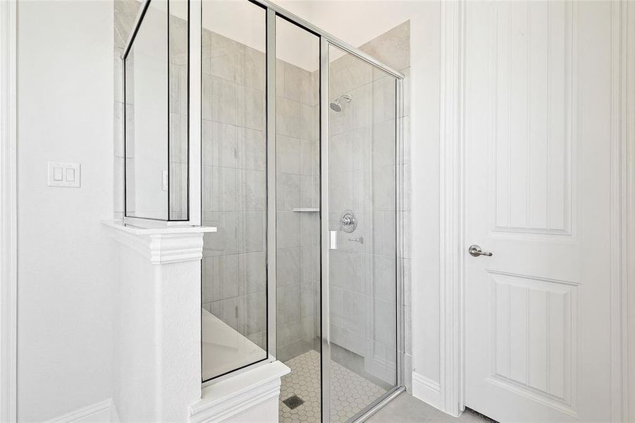Full bath featuring a shower stall