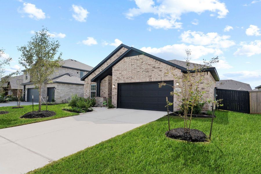 Another delightful view of this eye-catching front elevation! The curb appeal truly shines with lush landscaping, a spacious driveway, and a modern design that feels both elegant and welcoming. It’s easy to picture morning coffee on the front porch or cheerful family arrivals for weekend get-togethers. Every detail outside hints at the beauty waiting inside!