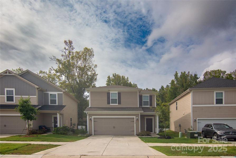 Front exterior of a new home in Belterra, Charlotte, NC, highlighting curb appeal (Image 12).