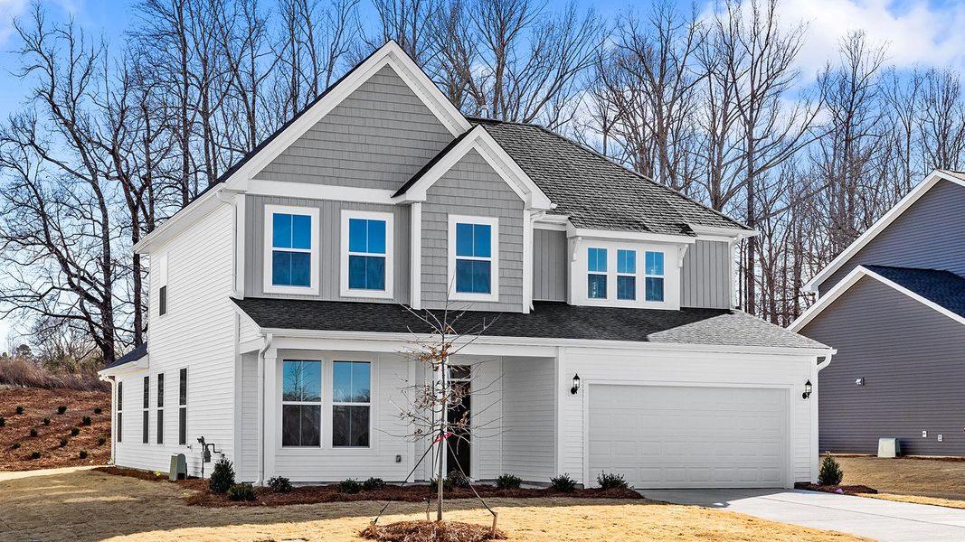 Front exterior of a new home in Fieldstone, Lexington, NC, highlighting curb appeal (Image 2). Front exterior of a new home in Fieldstone, Lexington, NC, highlighting curb appeal (Image 2).