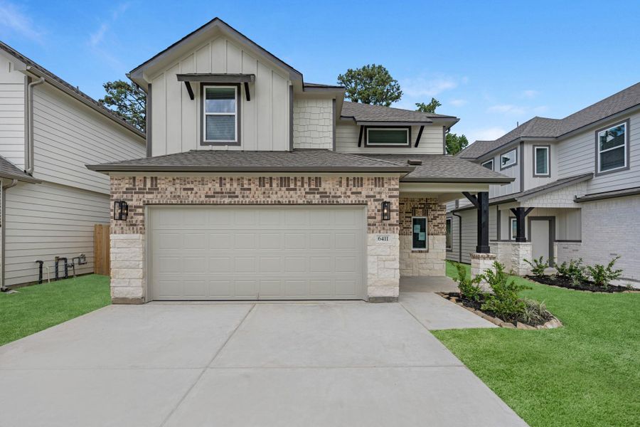 Front exterior of a new home in Cypresswood Landing, Humble, TX, highlighting curb appeal (Image 17).