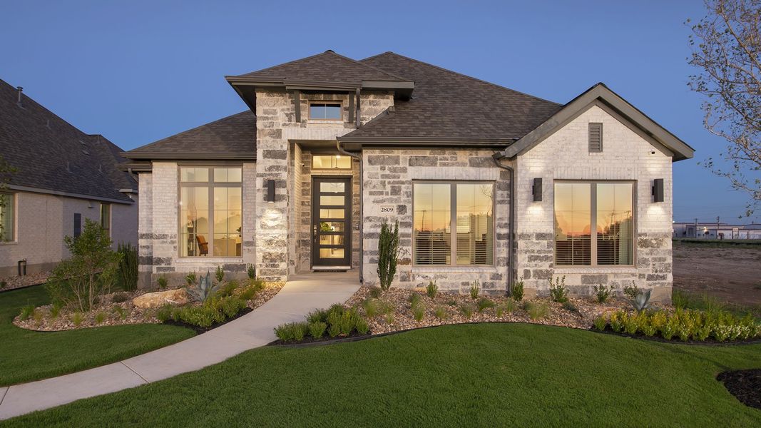Front exterior of a new home in Meadows of Mill Creek, Seguin, TX, highlighting curb appeal (Image 2). Front exterior of a new home in Meadows of Mill Creek, Seguin, TX, highlighting curb appeal (Image 2).