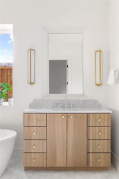 Bathroom featuring vanity and a bathing tub