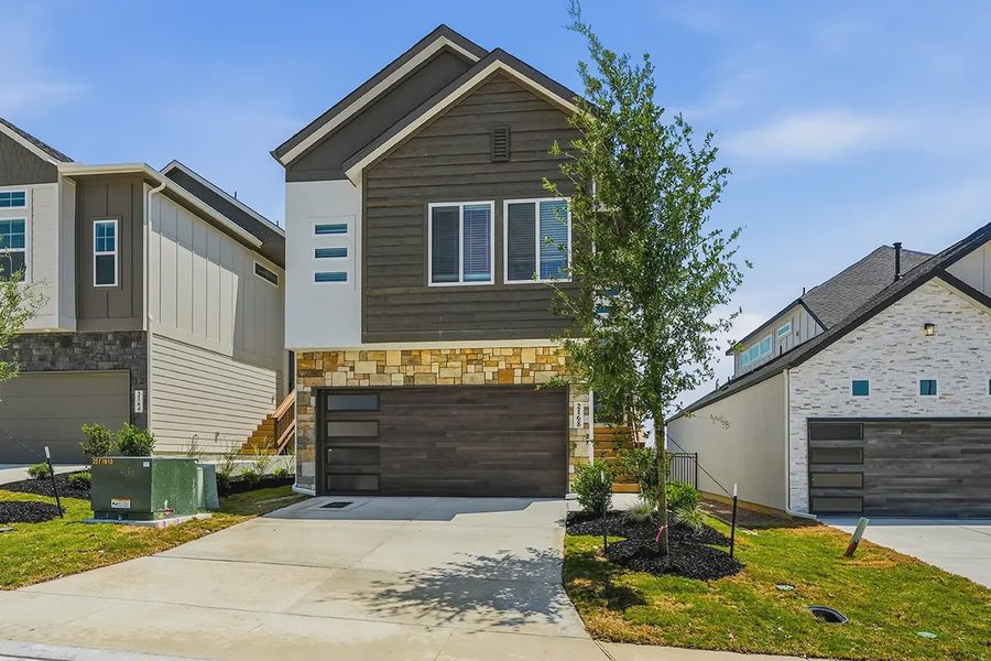 Representative exterior photo of a completed home built from the Athena by Chesmar Homes in Prominence Urban, San Antonio, TX (Image 22).