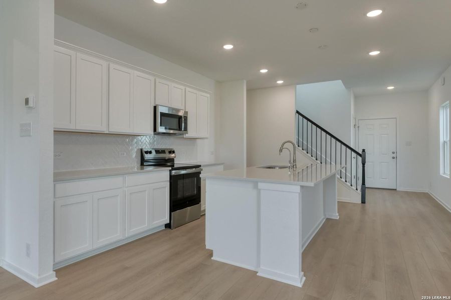 Furnished interior view inside a new home in Hennersby Hollow, San Antonio (Image 6). Furnished interior view inside a new home in Hennersby Hollow, San Antonio (Image 6).
