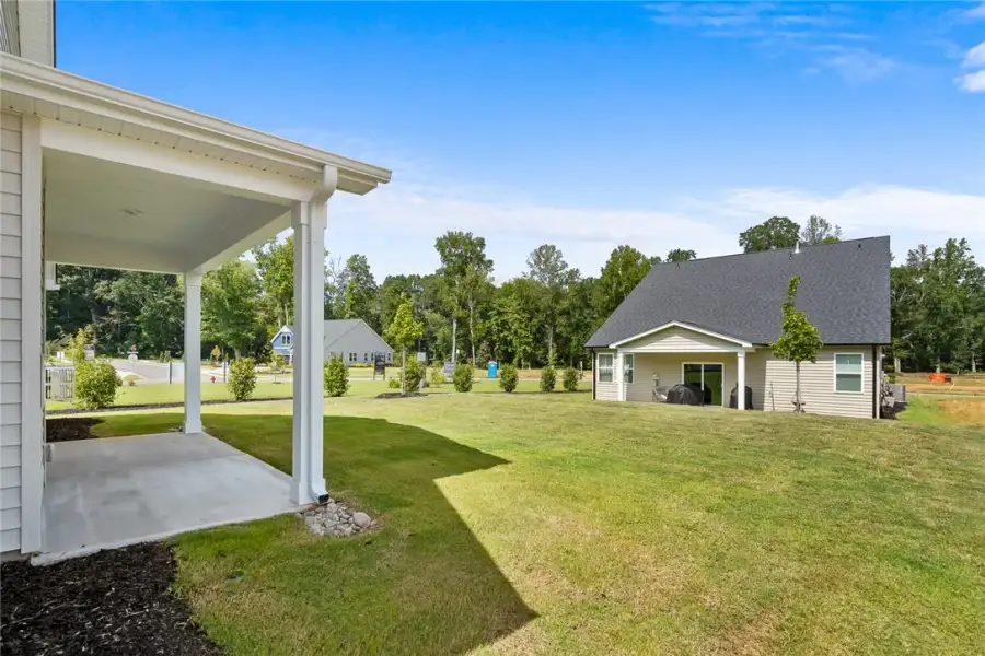 Exterior details and patio area of a home in Saratoga Oaks, Williamston (Image 25). Exterior details and patio area of a home in Saratoga Oaks, Williamston (Image 25).