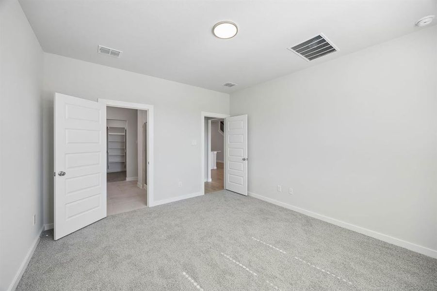 Primary Suite in the Mesquite home plan by Trophy Signature Homes – REPRESENTATIVE PHOTO