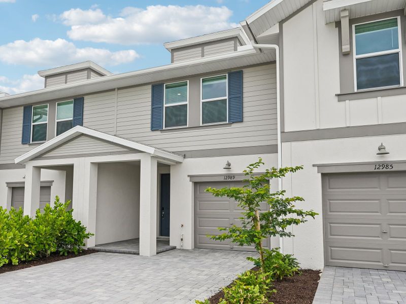 Front exterior of a new home in Meritage Homes at Central Park, Port St. Lucie, FL, highlighting curb appeal (Image 2). Front exterior of a new home in Meritage Homes at Central Park, Port St. Lucie, FL, highlighting curb appeal (Image 2).