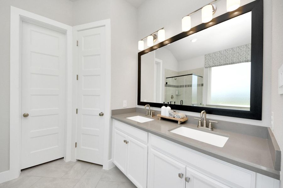 Furnished interior view inside a new home in Sunterra: Premier Collection, Katy (Image 15).