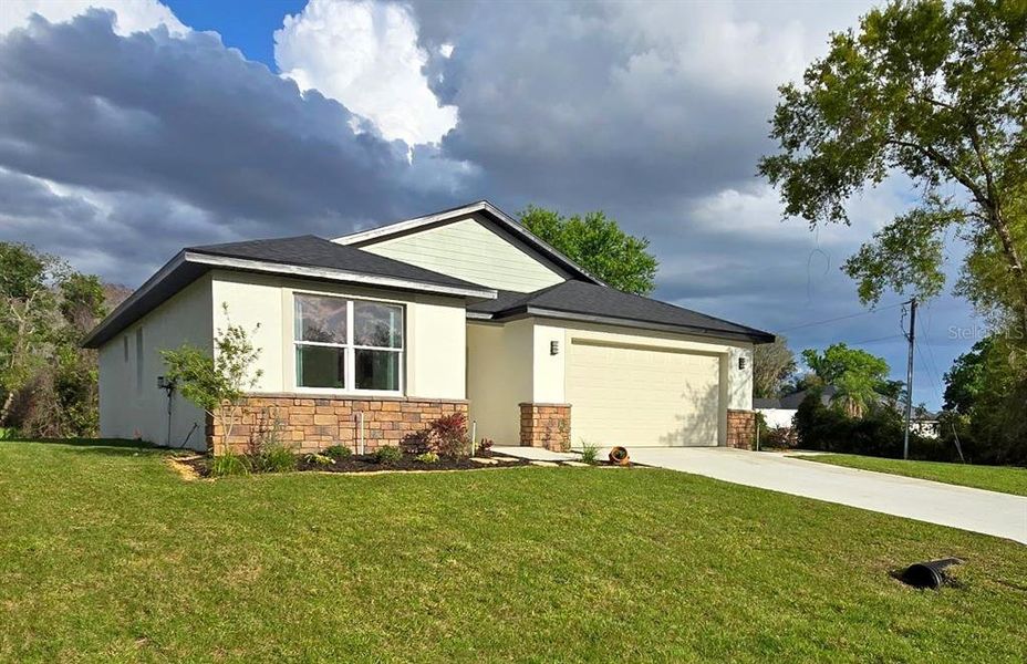 Front exterior of a new home in , Sebring, FL, highlighting curb appeal (Image 23). Front exterior of a new home in , Sebring, FL, highlighting curb appeal (Image 23).
