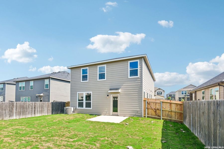Exterior details and patio area of a home in Woodside Farms, Seguin (Image 4).