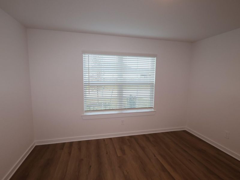 Spacious, unfurnished interior of a new home in Pinewood at Grand Texas, New Caney (Image 14).