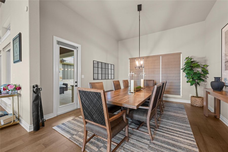 This formal dining space offers natural light and direct patio access, ideal for seamless indoor-outdoor entertaining. This formal dining space offers natural light and direct patio access, ideal for seamless indoor-outdoor entertaining.