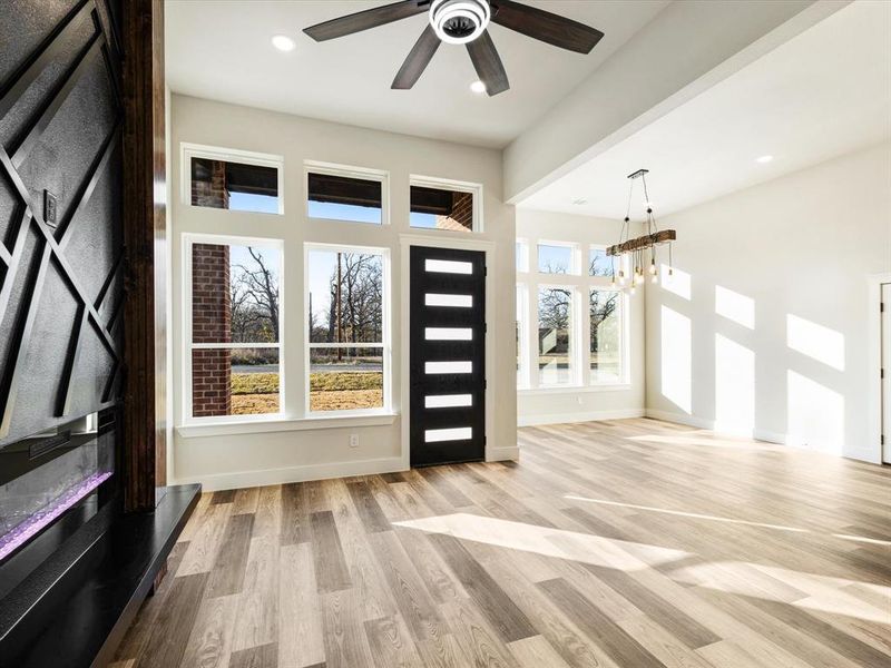 Foyer entrance with light wood-type flooring, a chandelier, and recessed lighting Foyer entrance with light wood-type flooring, a chandelier, and recessed lighting