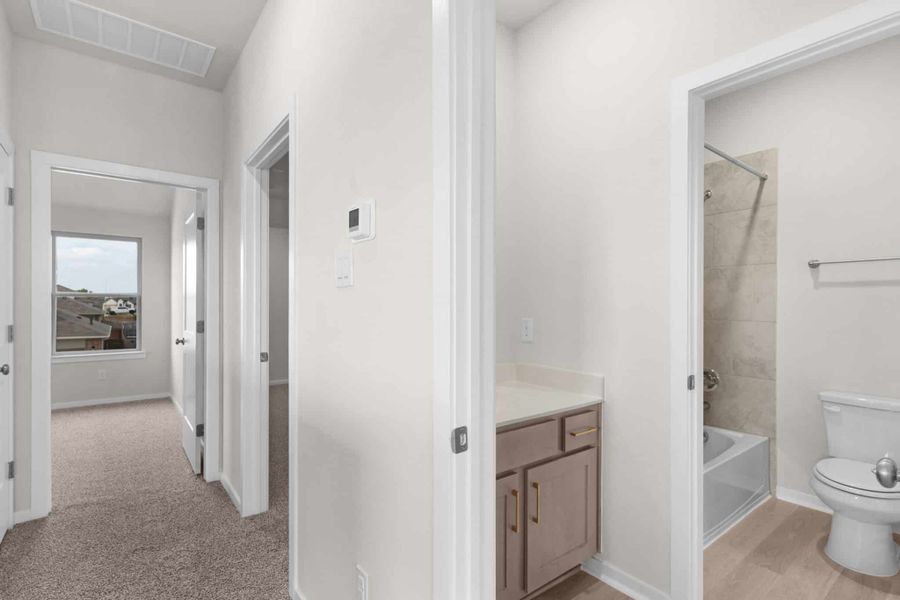 Furnished interior view inside a new home in University Heights, Round Rock (Image 10).