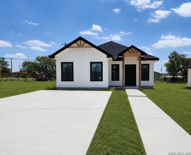 Front exterior of a new home in , Eagle Pass, TX, highlighting curb appeal (Image 1). Front exterior of a new home in , Eagle Pass, TX, highlighting curb appeal (Image 1).