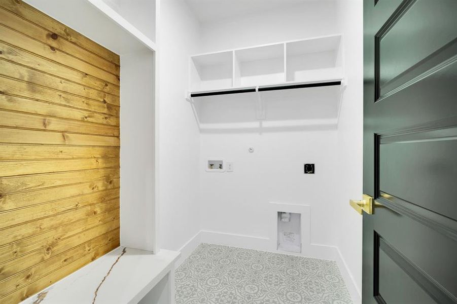 Dedicated laundry room with room for storage.