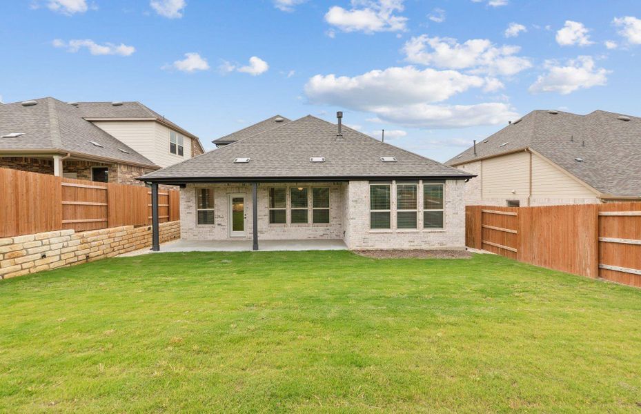 Front exterior of a new home in West Cypress Hills, Spicewood, TX, highlighting curb appeal (Image 2).