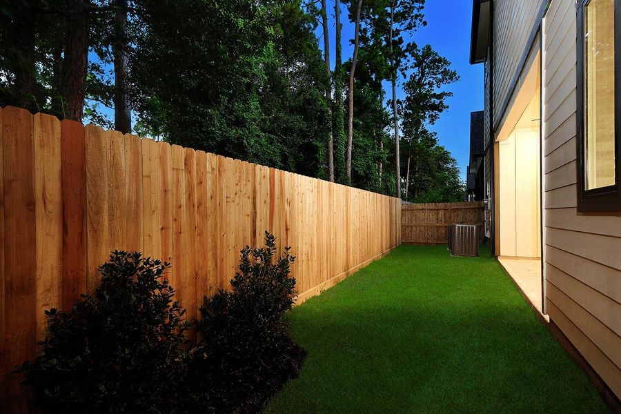 Exterior details and patio area of a home in , The Woodlands (Image 23). Exterior details and patio area of a home in , The Woodlands (Image 23).