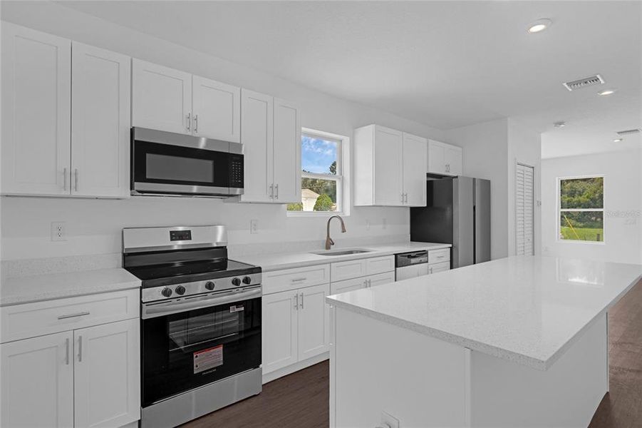 kitchen with soft close cabinets * all new stainless steel appliances * granite countertops and bar area with a nice window view over the sink.