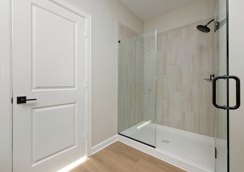 Step-in shower with tile detail in the master bathroom Step-in shower with tile detail in the master bathroom