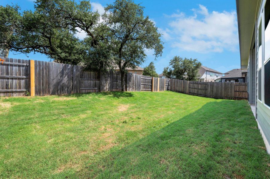 View of fenced backyard
