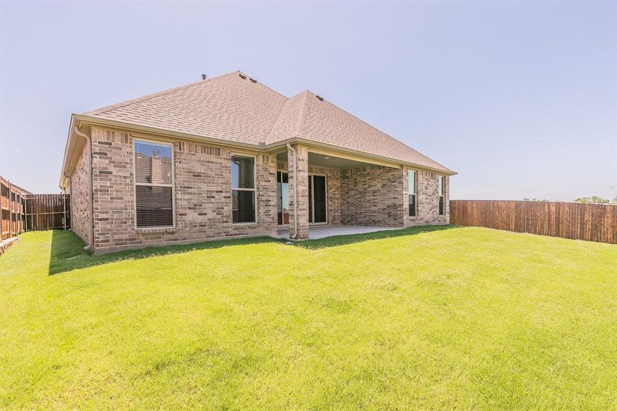 Front exterior of a new home in , Alvarado, TX, highlighting curb appeal (Image 2).
