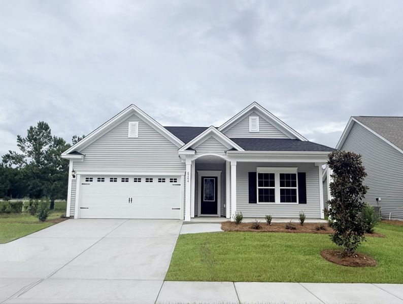 Front exterior of a new home in Arcadia, Myrtle Beach, SC, highlighting curb appeal (Image 1). Front exterior of a new home in Arcadia, Myrtle Beach, SC, highlighting curb appeal (Image 1).