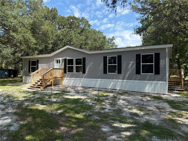 Exterior details and patio area of a home in , Polk City (Image 12).